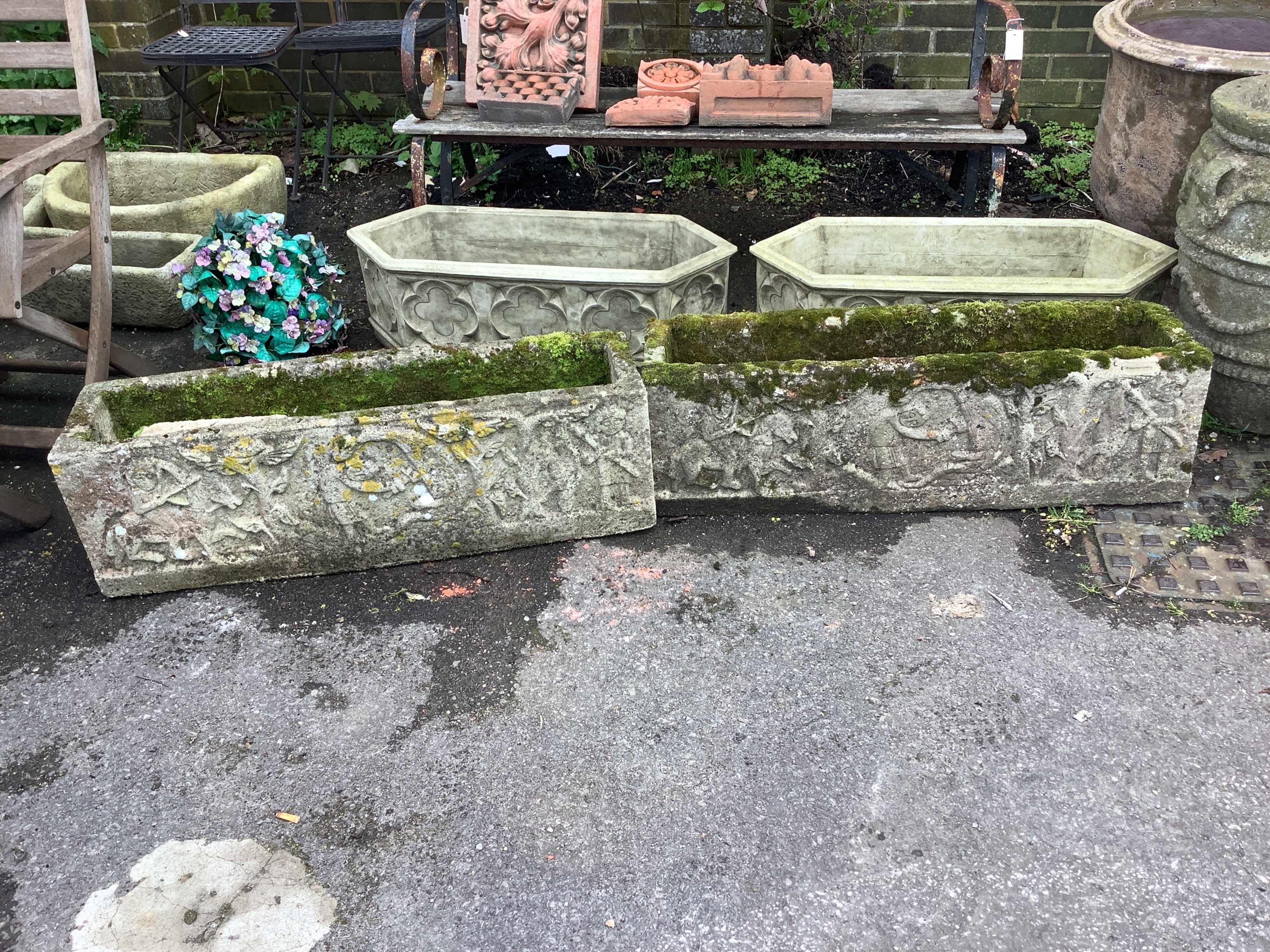 A pair of rectangular reconstituted stone garden trough planters, moulded with classical figures, width 98cm, depth 25cm, height 30cm